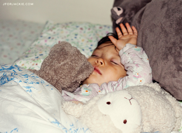 Sleeping Julienne with her stuffed animals